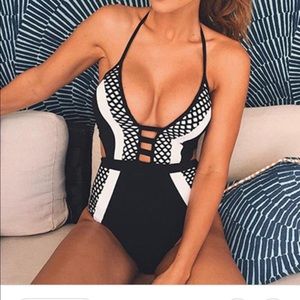 Black and white bathing suit. Never been worn.